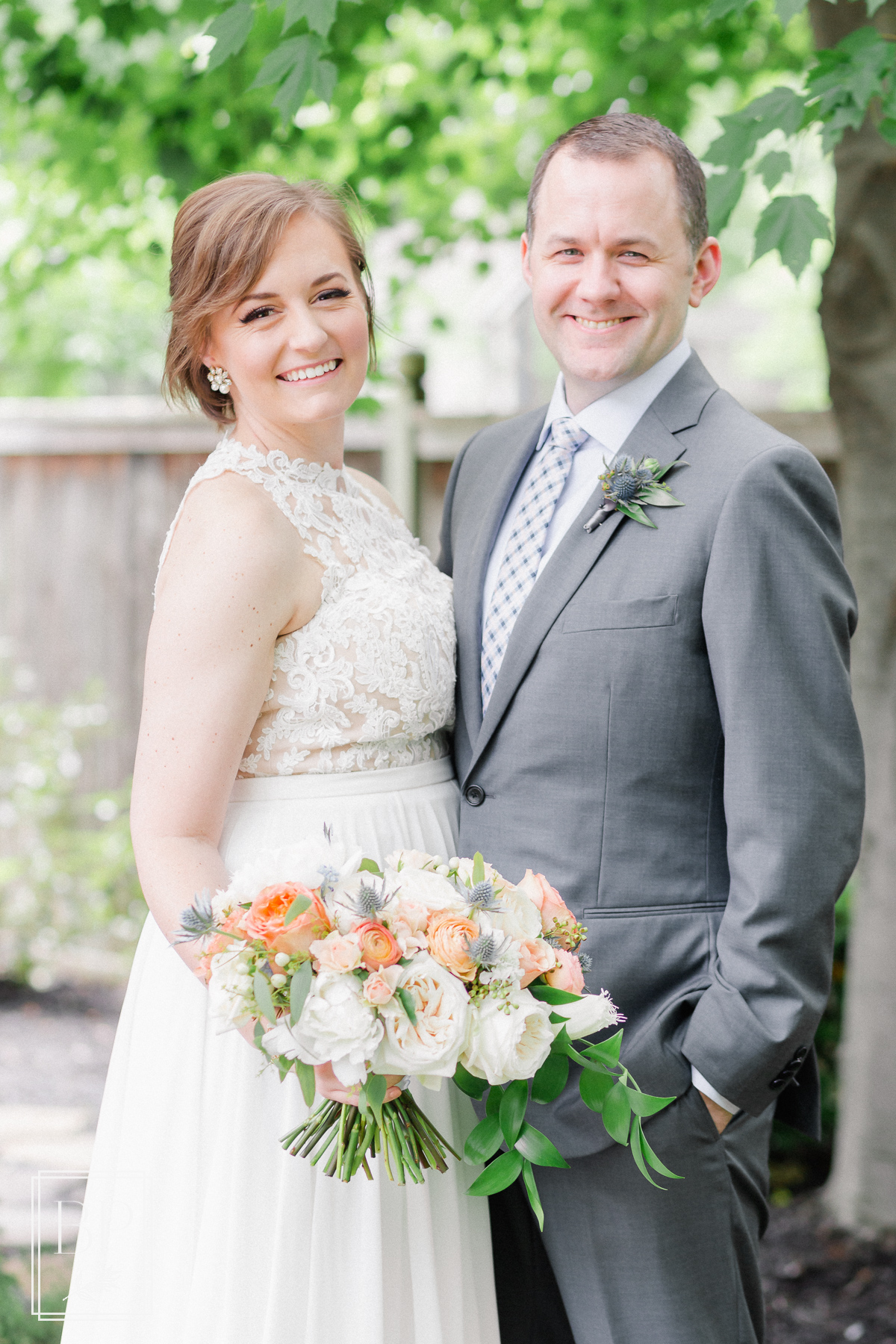 intimate spring peach, navy & green backyard wedding with BHLDN gown