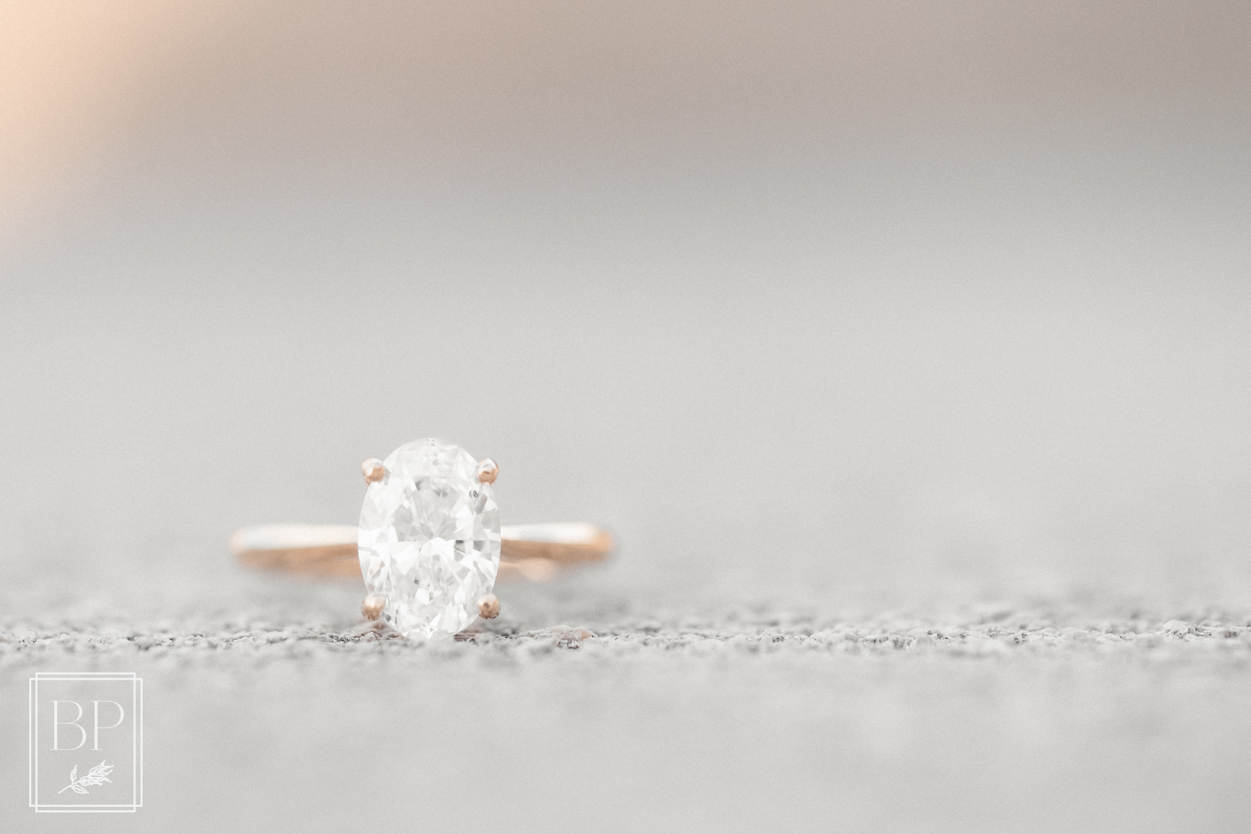 solitaire oval and yellow gold diamond engagement ring