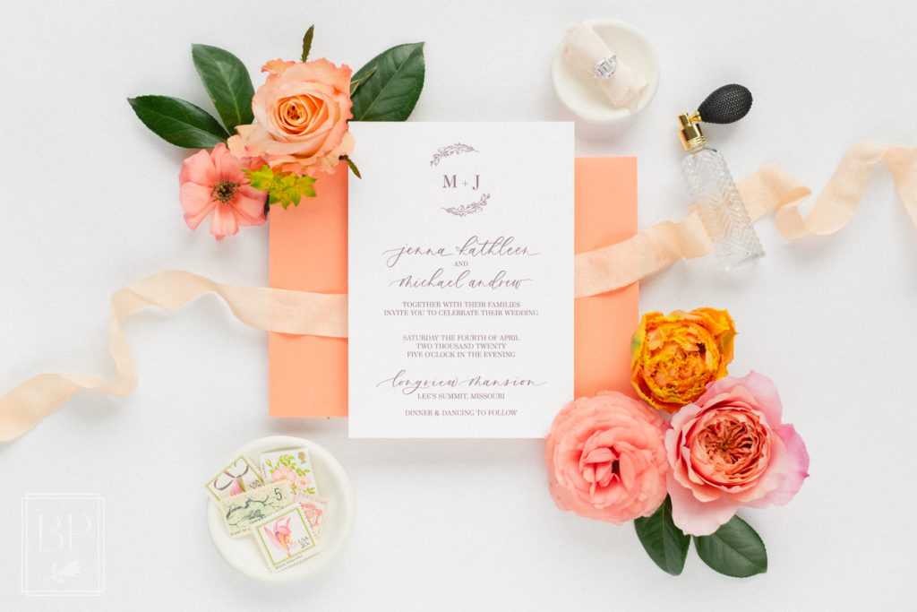 pink and orange spring wedding invitation flat lay inspiration