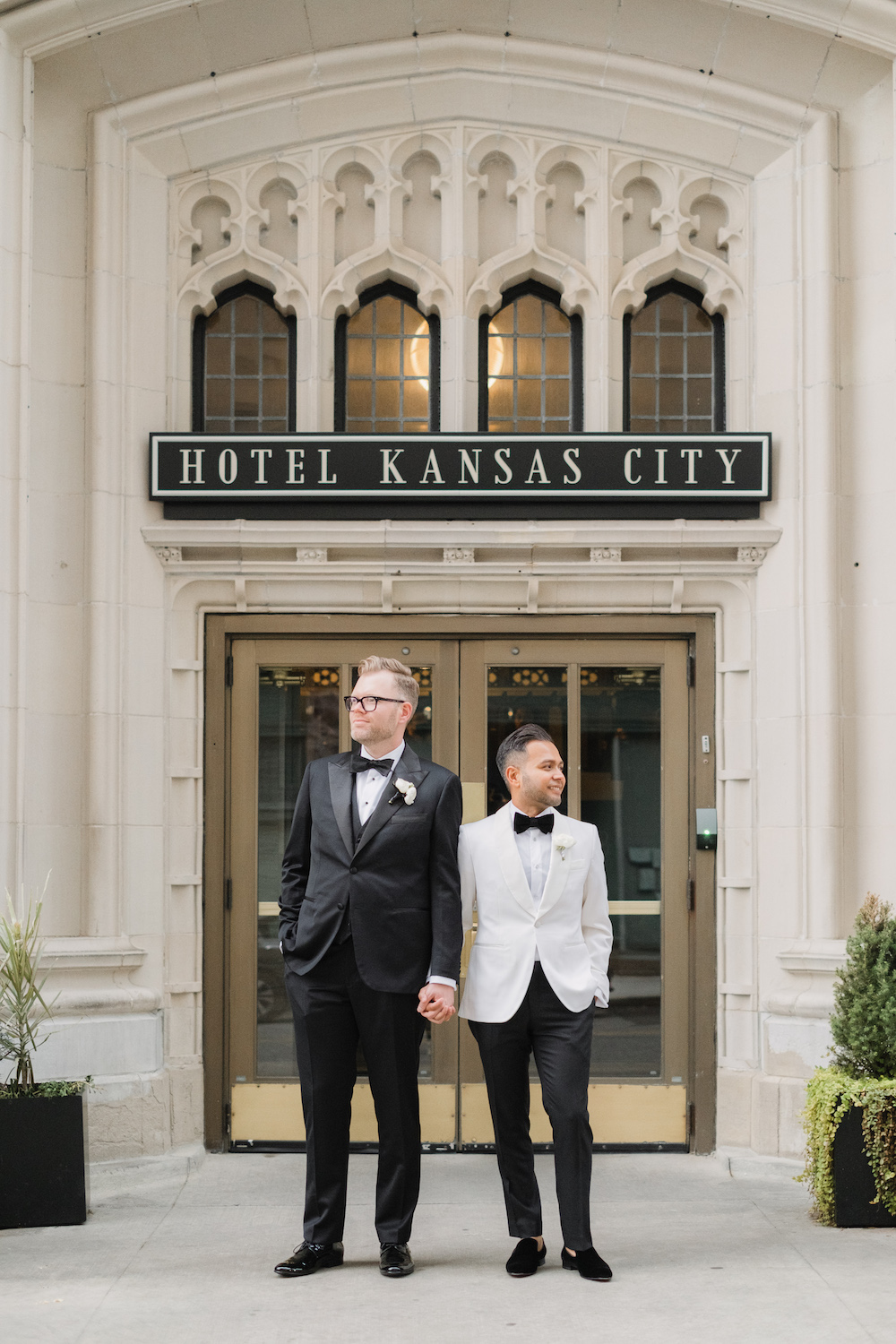 Elegant same sex black tie Hotel Kansas City wedding with Kauffman Center portraits
