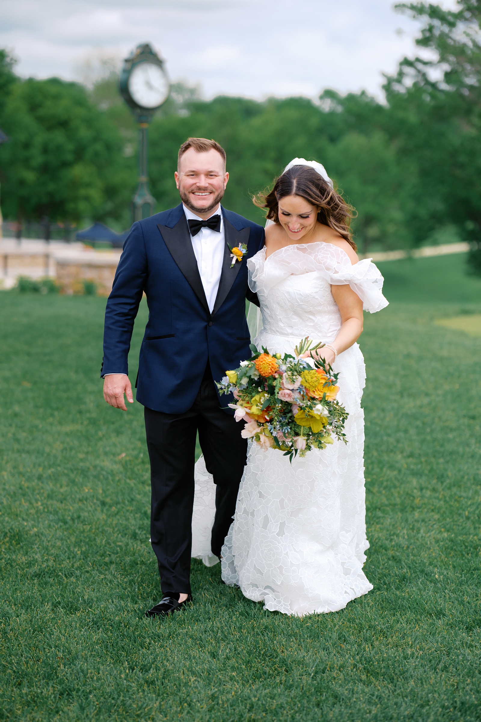 wedding colorful walks with colorful bouquet at Oakwood Country Club